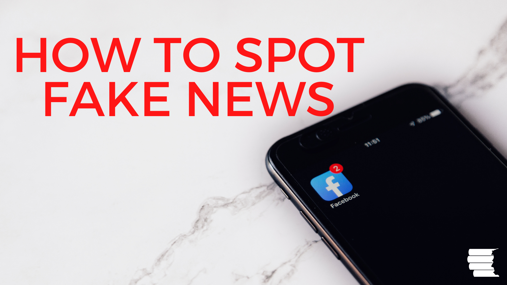 how to spot fake news_iphone with facebook icon
