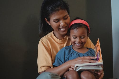 mother and daughter reading together