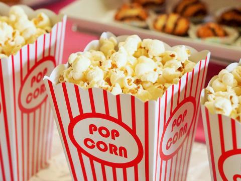 Popcorn in red and white striped containers