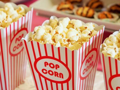 popcorn in red and white striped containers