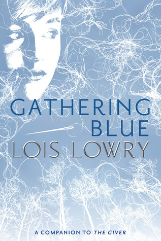 A blue and white book cover with "Gathering Blue" in the center. The outline of a face is in the top left corner.