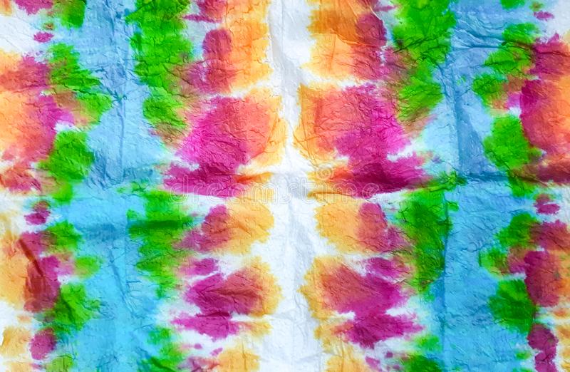 An abstract, rainbow design in watercolor-like paint.