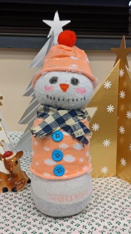 Photo of Saturday Crafternoon craft for January 2023, showing a snowman plushie made from a sock