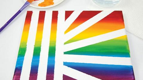A multicolored canvas with straight white lines throughout. 