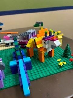 Two Lego dinosaur creations