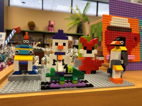A photograph of winter creatures made out of Lego bricks. 