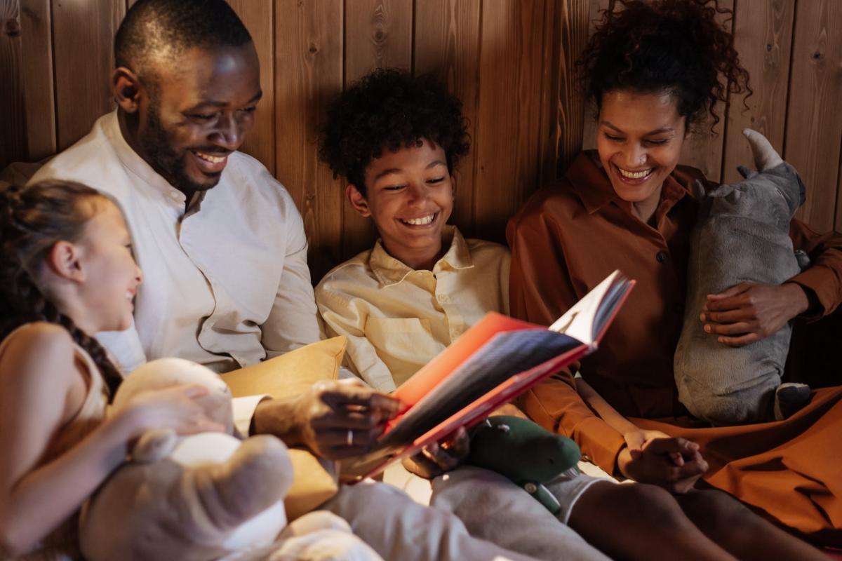 Family reading and laughing together
