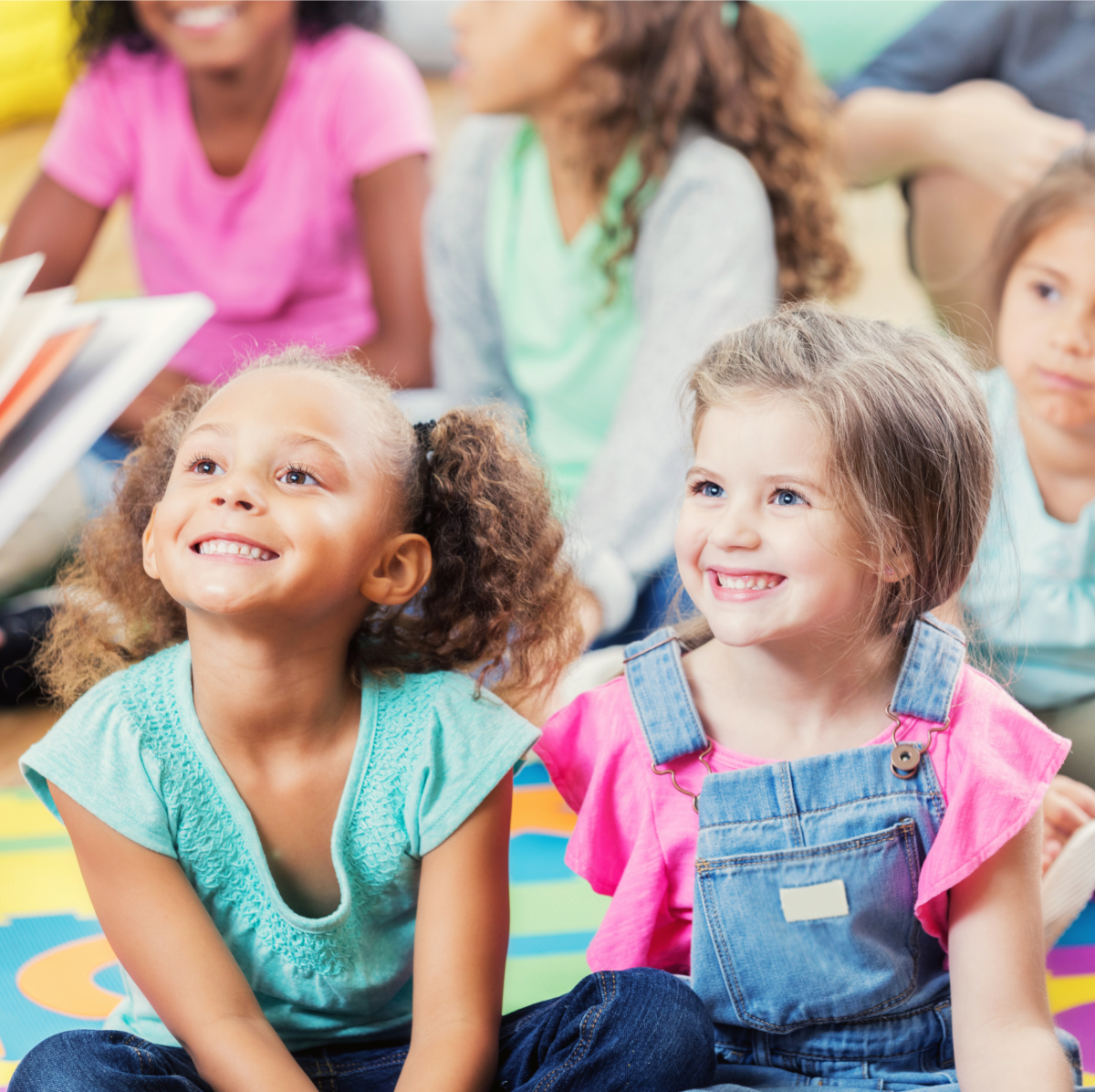 Young children listen to a story.